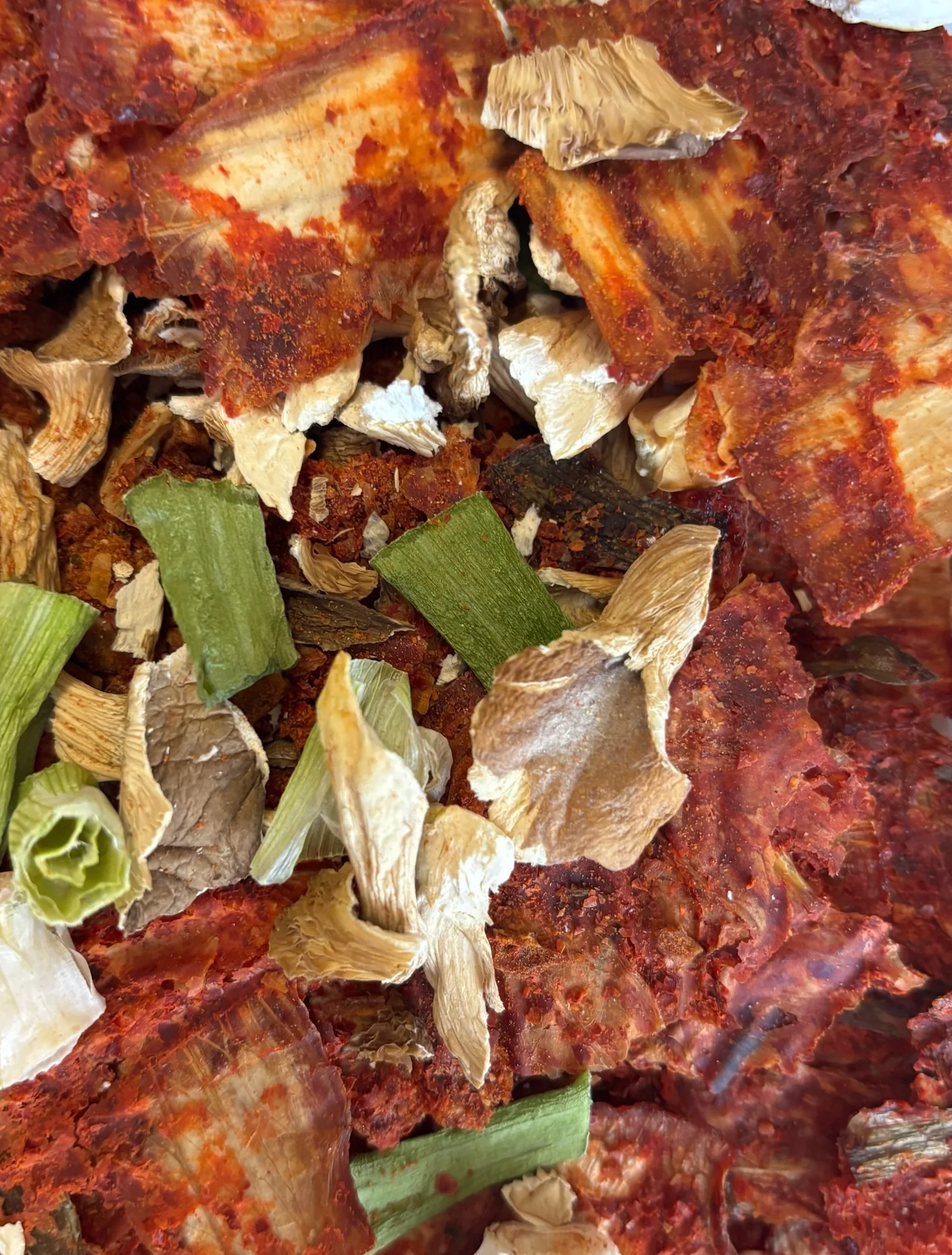 Close-up of dried kimchi, dried oyster mushrooms, and dried green onion in the Kimchi Jjigae Meal Starter