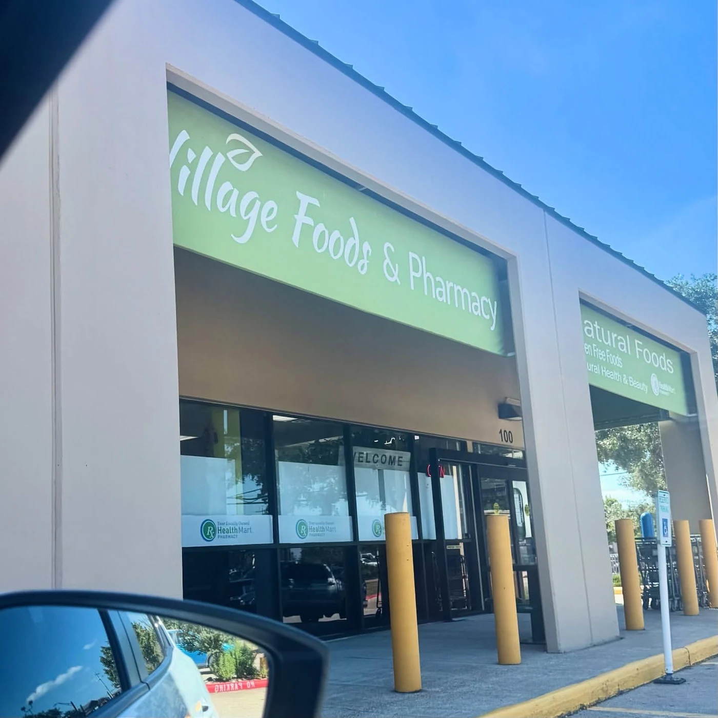 The exterior front of Village Foods & Pharmacy in Bryan, Texas
